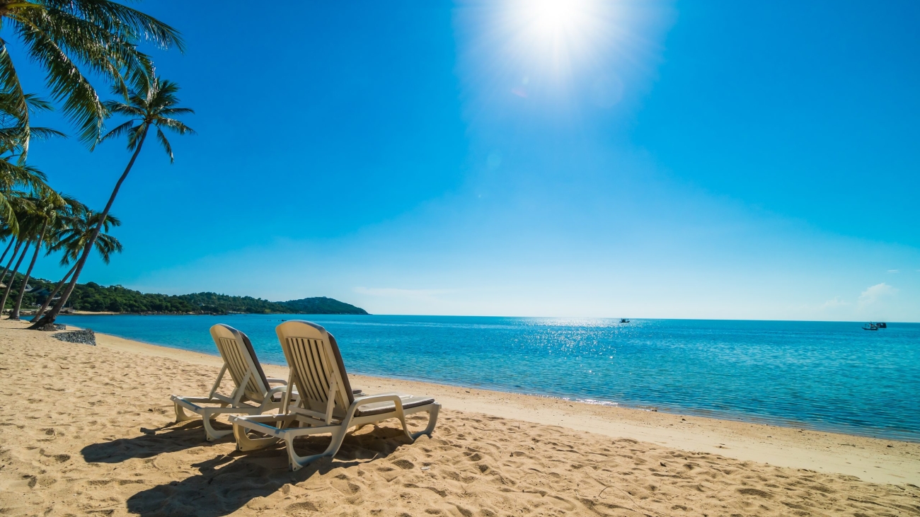 Beautiful tropical beach and sea with chair on blue sky for travel and vacation