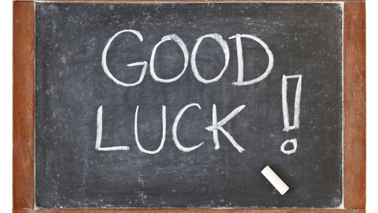 good luck - white chalk handwriting on isolated vintage slate blackboard
