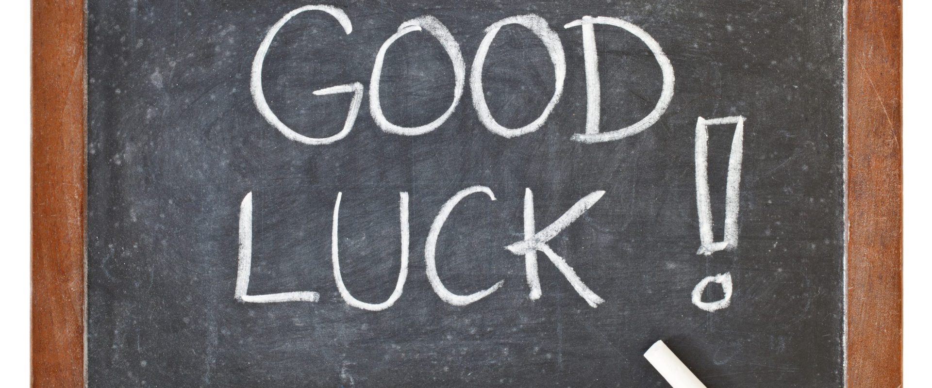 good luck - white chalk handwriting on isolated vintage slate blackboard